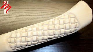 Wattle on the ax handle. Wood carving - woodcarving-ax handle on the axe