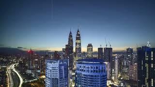 Star trail and Sunrise over Kuala Lumpur