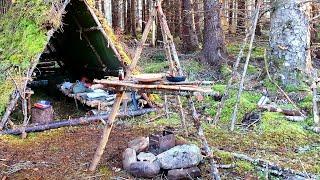 Bushcraft table and fire pit, bucksaw, pancakes at the bushcraft camp.