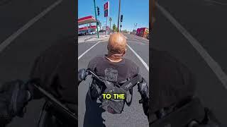 Biker pushes dude with wheelchair
