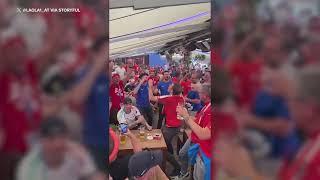 Austrian Fan Breaks Baguette to 'Pain' of French Supporters