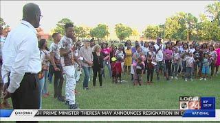 Family and friends hold vigil for victim of unsolved murder