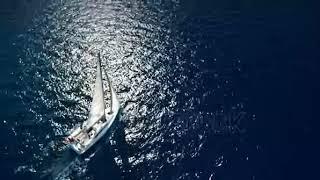 stock footage yacht sailing on opened sea sailing boat yacht from drone yachting video yacht from ab