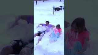 Alena and Pasha play outdoors in winter