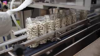 Inserting desiccant and cotton into tablet supplement bottles | Daily Dose - Ion Labs