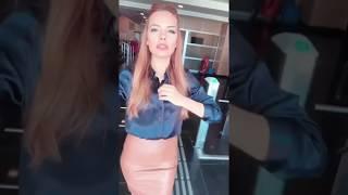 Deniz Satar  in Satin Blouse and Leather Skirt