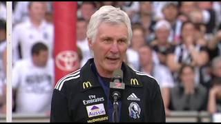 The Collingwood players receive their medals