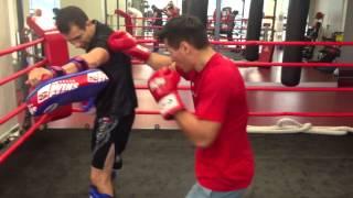 Multiple world kickboxing champion Batu Khasikov in training with coach Nikolai Kovalevich