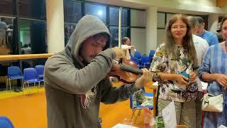 A man from Costa Rica plays the violin 