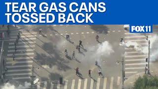 Downtown Los Angeles protests: Police, crowd toss tear gas back and forth  | FOX 11 LA