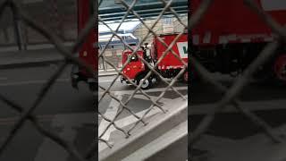 A Red Waste Management Mack MRU Mcneilus RL trash truck