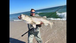 MONSTER STRIPED BASS IN NEW JERSEY SURF FISHING!