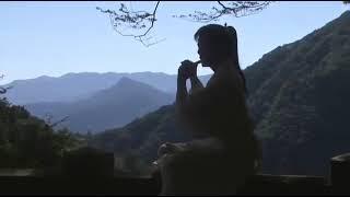 Hideaki Takizawa plays a flute in Yoshitsune (2005)