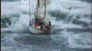 Stormy weather - sailboat in distress at sea