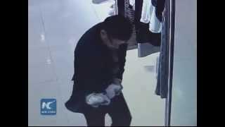 Caught on camera: Man sneaks $7,500 fur coat down his pants