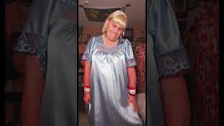 Wendy wearing a blue satin negligee nightdress