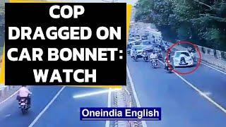 Cop dragged on bonnet of car in Delhi | Caught on camera | Oneindia News