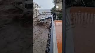 Water Piles Up Cars in Sicily Flooding