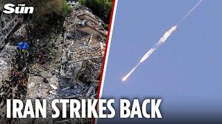 Wounded Iran lashes out at Israel with wave of ballistic missiles after US nuke base blitz