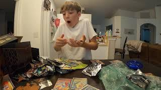 Kid pulling a Charizard vmax out of a Shining Fates ETB