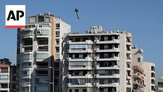 How AP photographer captured an Israeli strike on a Beirut building