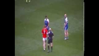 Peter Harte gets a yellow card for fouling Dick Clerkin