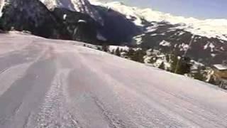 Ahorn. Video made from a snowboard on a mountain-skiing slope.