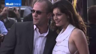 Kelly Brook and Jason Statham on red carpet in 2003