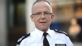 London Met Police Commissioner grabs microphone from reporter's hand