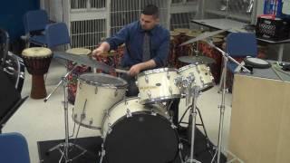 Ben Haines performing a latin drum beat on a drum set