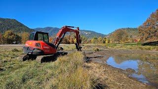 Beautiful day cow pond clean with the Kubota KX 080 4