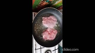 pork steak with tomato and cucumber salad with olive oil and vinegar.