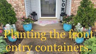 Planting up containers in the front entry way.