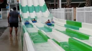 Girls getting wedgie's on water slide.