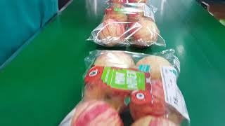 Redpack Flow wrapping apples close up