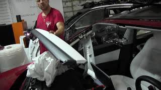 We remove the front panel of the Tesla Model 3 electric car. Disassembly and repair of Tesla cars.