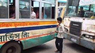 Dhaka city bus helper calling for passenger