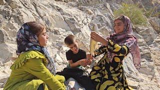 Fishing in the raging river by a nomadic family