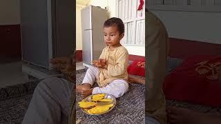 Uzman Watto is playing with Mangoes