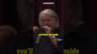 Joe Rogan learns how to smoke a cigar