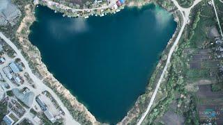 Novonikolaevsky quarry heart with a turquoise lake.