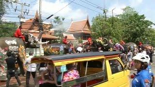 Watch elephants spray tourists during the Thai New Year festival