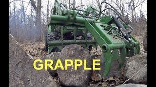 John Deere 3038E (tractor & grapple work) - WRESTLING ROCKS!!!