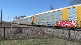 NS 18D Loaded racks BMW by Magnolia 3-8-25 ES44AC and Dash 9 lead on approach to Beaumont