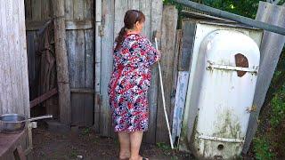 Village lifestyle of a young Grandmother. Rural life in Eastern Europe