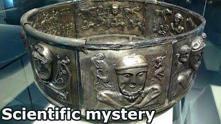 What mysteries hide the images on the silver cauldron