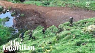 Footage appears to show Tom Phillips and his three children walking in rugged terrain