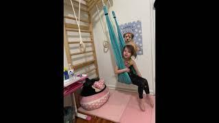 Little girl doing gymnastics like a pro athlete.