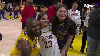 LeBron takes picture with young fan after win over the Miami Heat  | NBA on ESPN