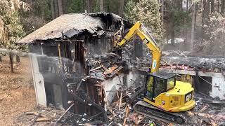 Hard demolition, burnt residential home